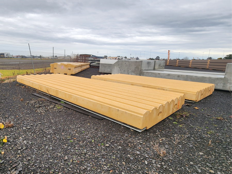 Precast concrete panels stacked on a site hardstand