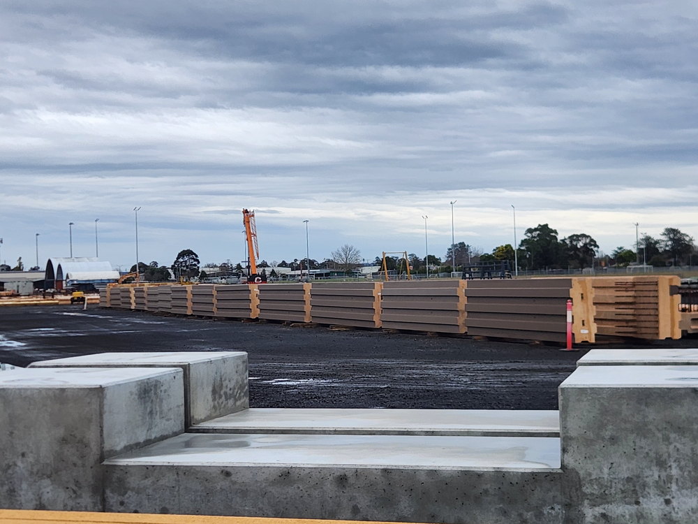 Precast units and barriers set out on a site hardstand